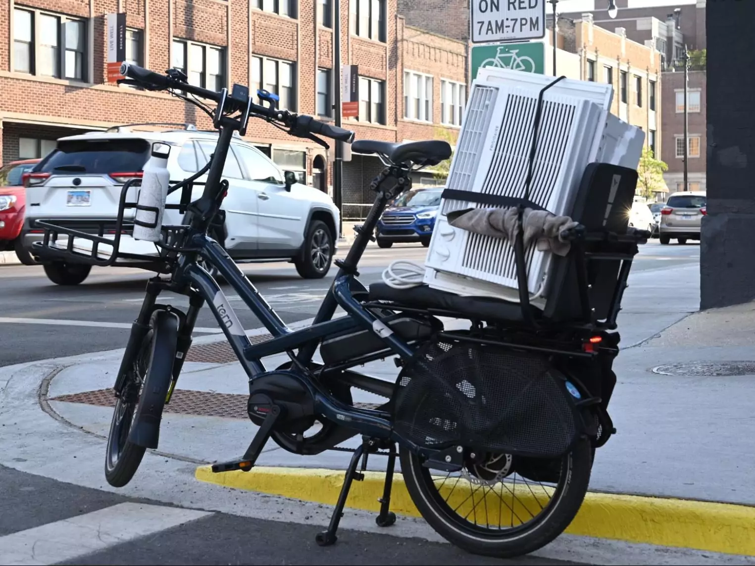 Viktor's Tern with a large window unit A/C strapped down on the back.