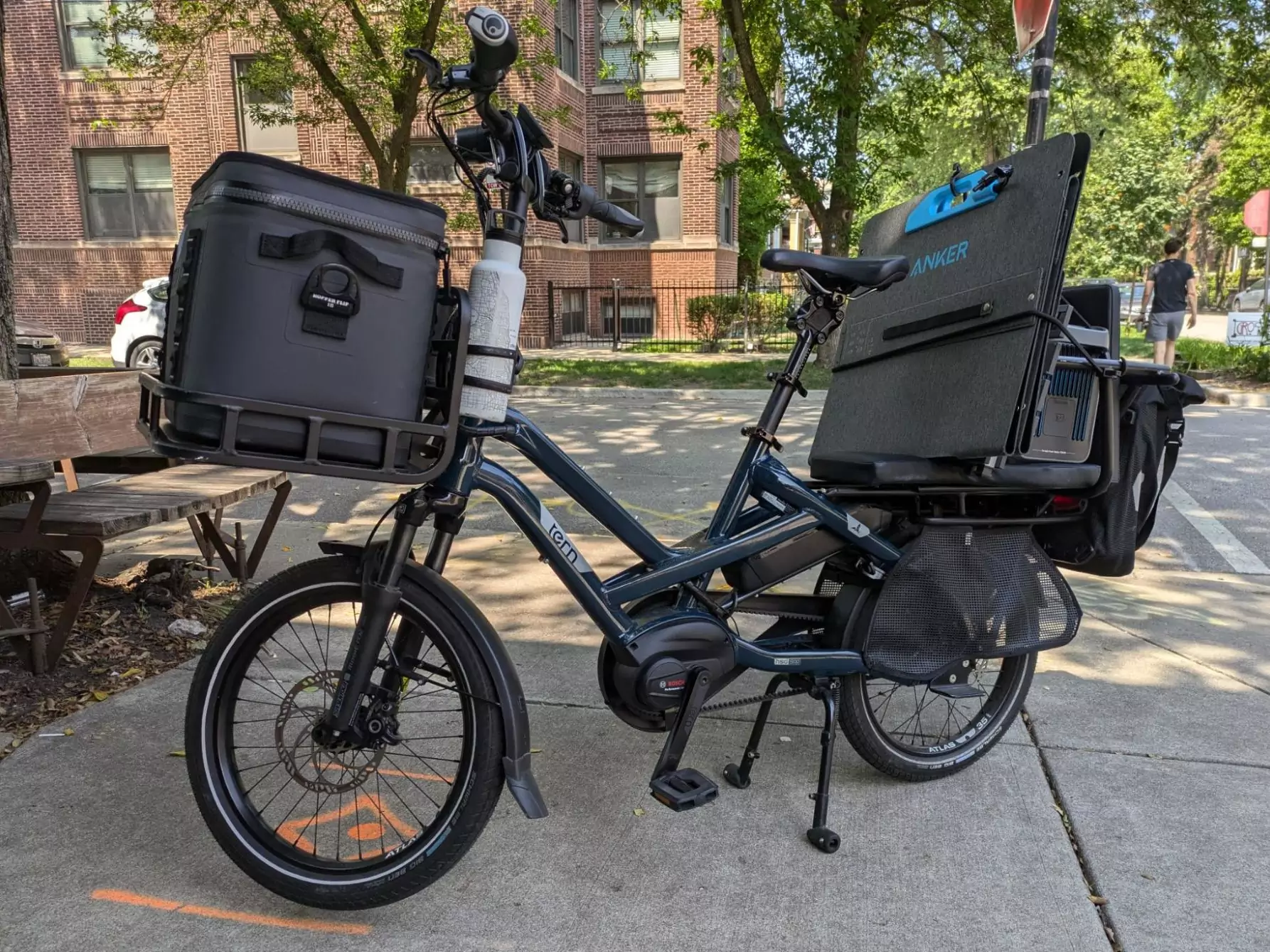 Viktor's Tern with a solar panel and battery on the back and a cooler on the front.